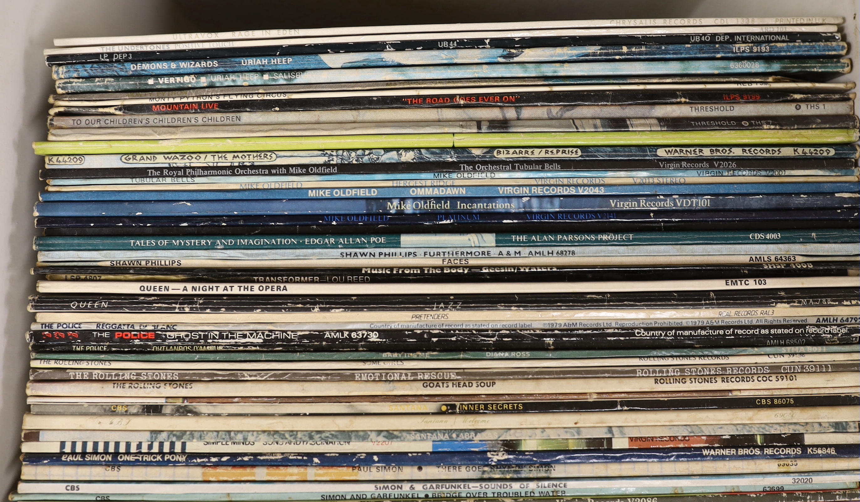 Fifty-eight LP record albums by artists including; Cat Stevens, The Sex Pistols, Simon & Garfunkel, Rolling Stones, the Police, Queen, Lou Reed, Mike Oldfield, Uriah Heep, Ultravox, etc.